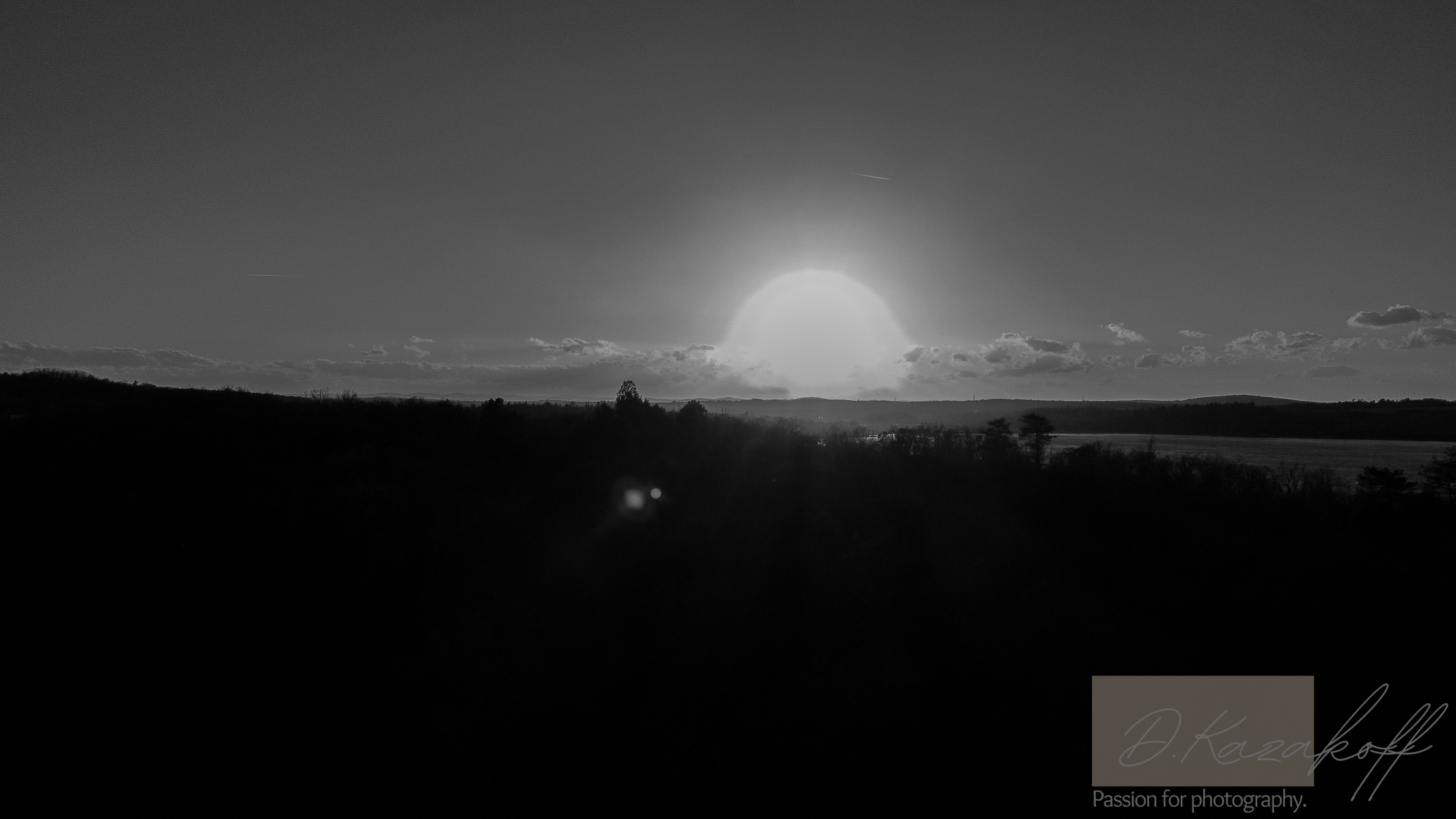 Sunset over sea and forest